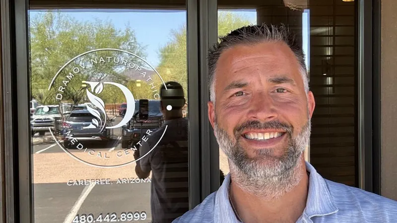 Dr. Rob Dramov at the entrance of Dramov Naturopathic Medical Center in Carefree, Arizona