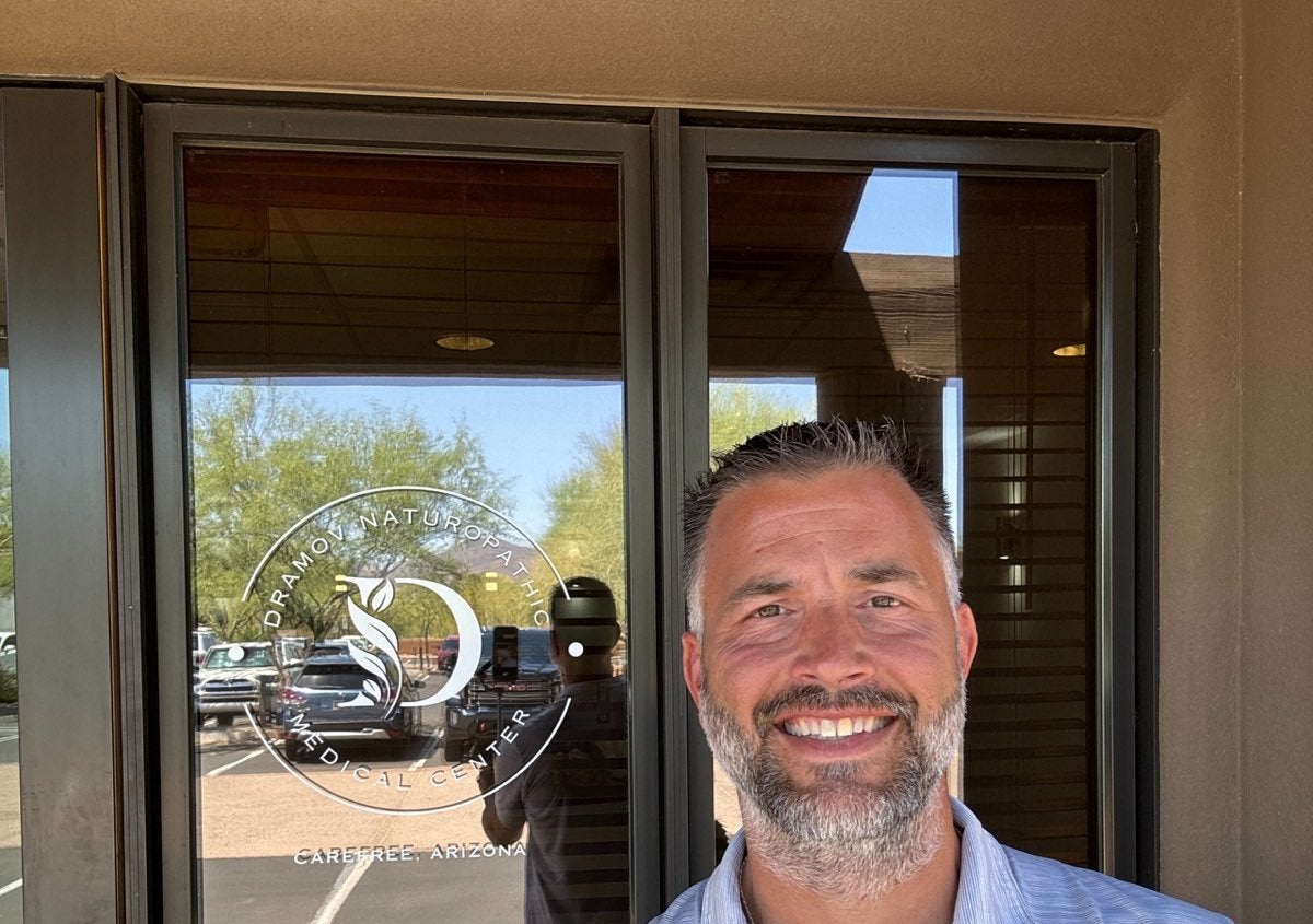 Dr. Rob Dramov at the entrance of Dramov Naturopathic Medical Center in Carefree, Arizona